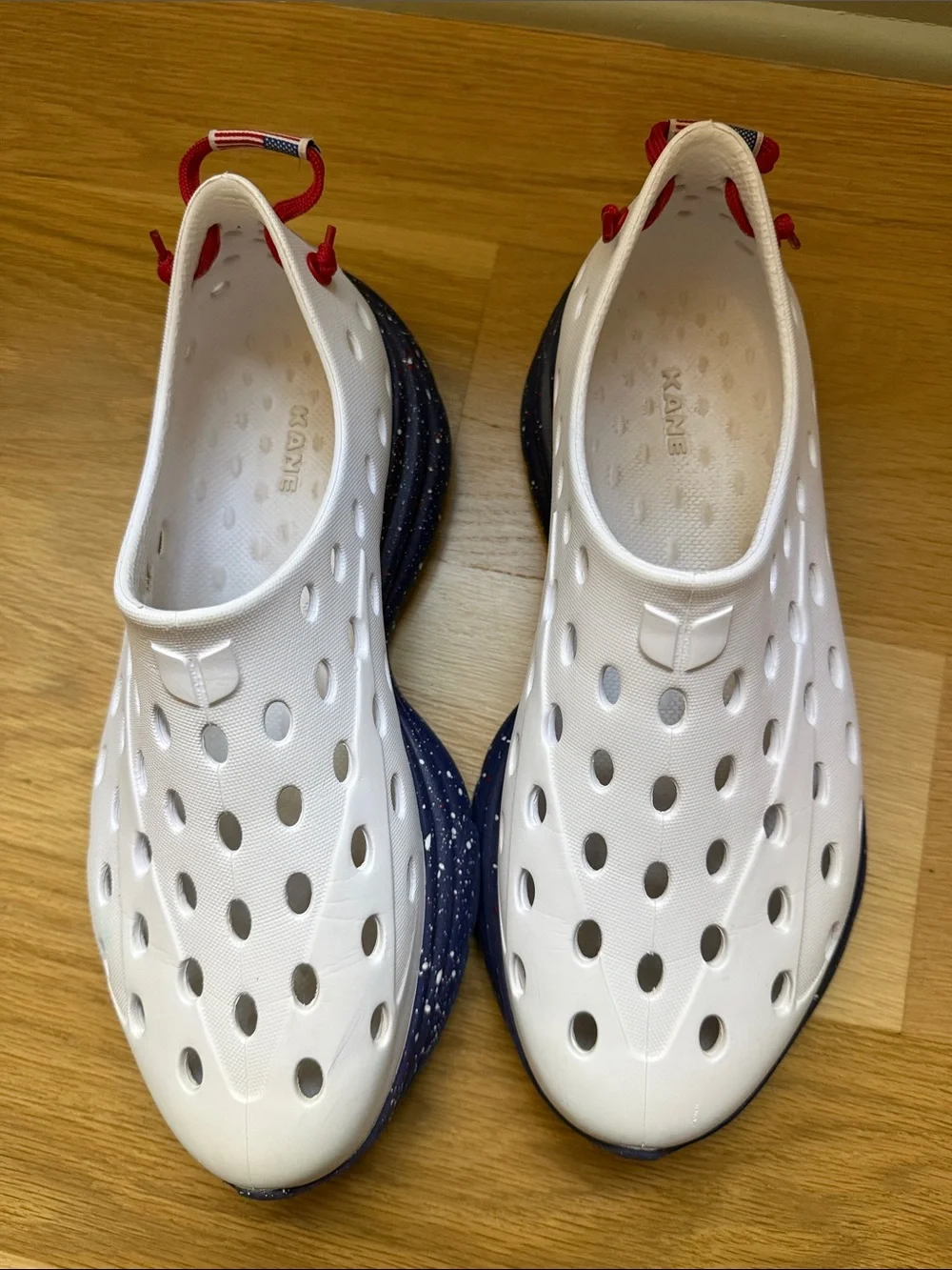 Men’s Kane shoes white with blue bottom and white and red speckles
